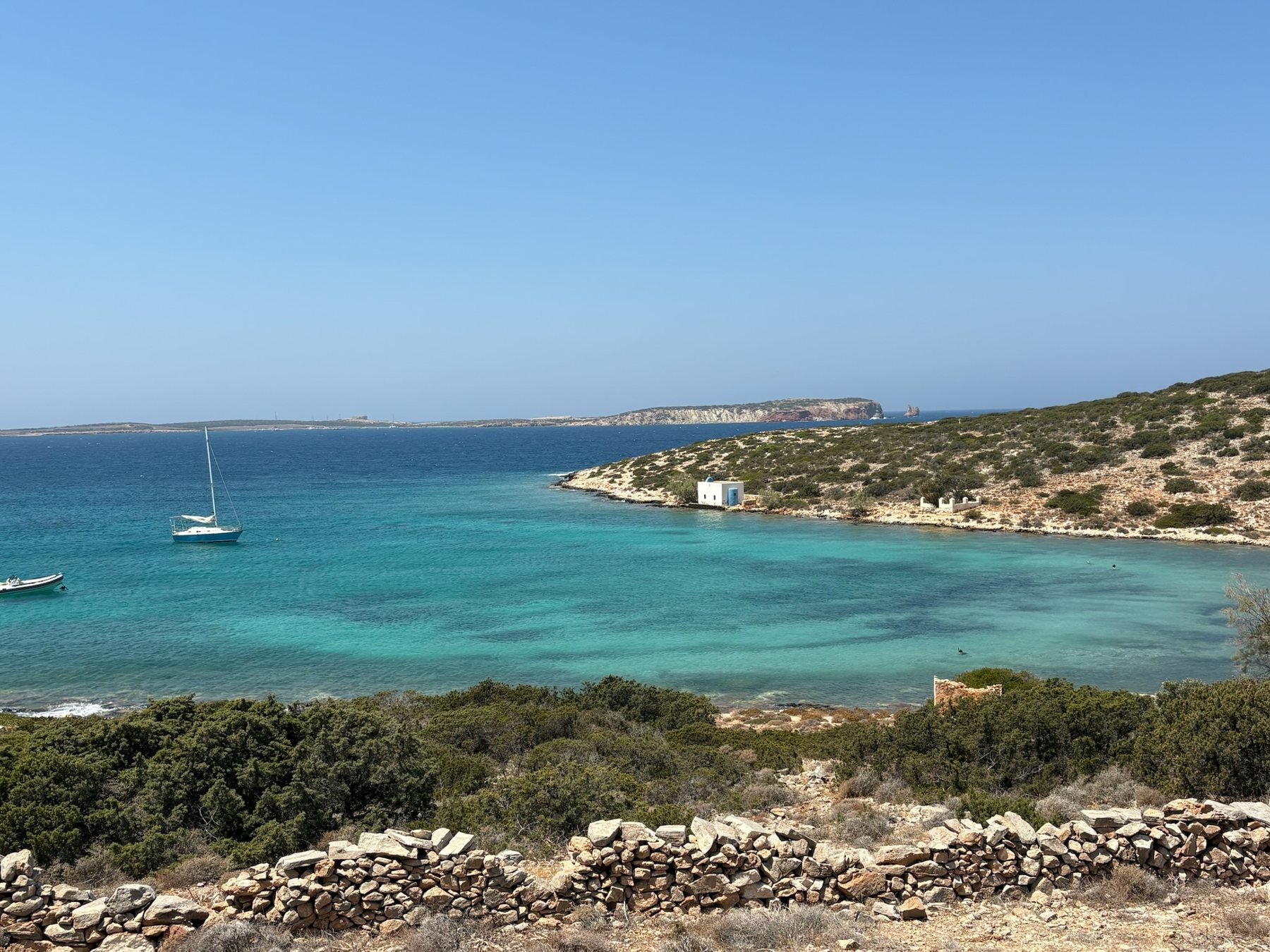 Turquoise water along a rocky Greek coastline