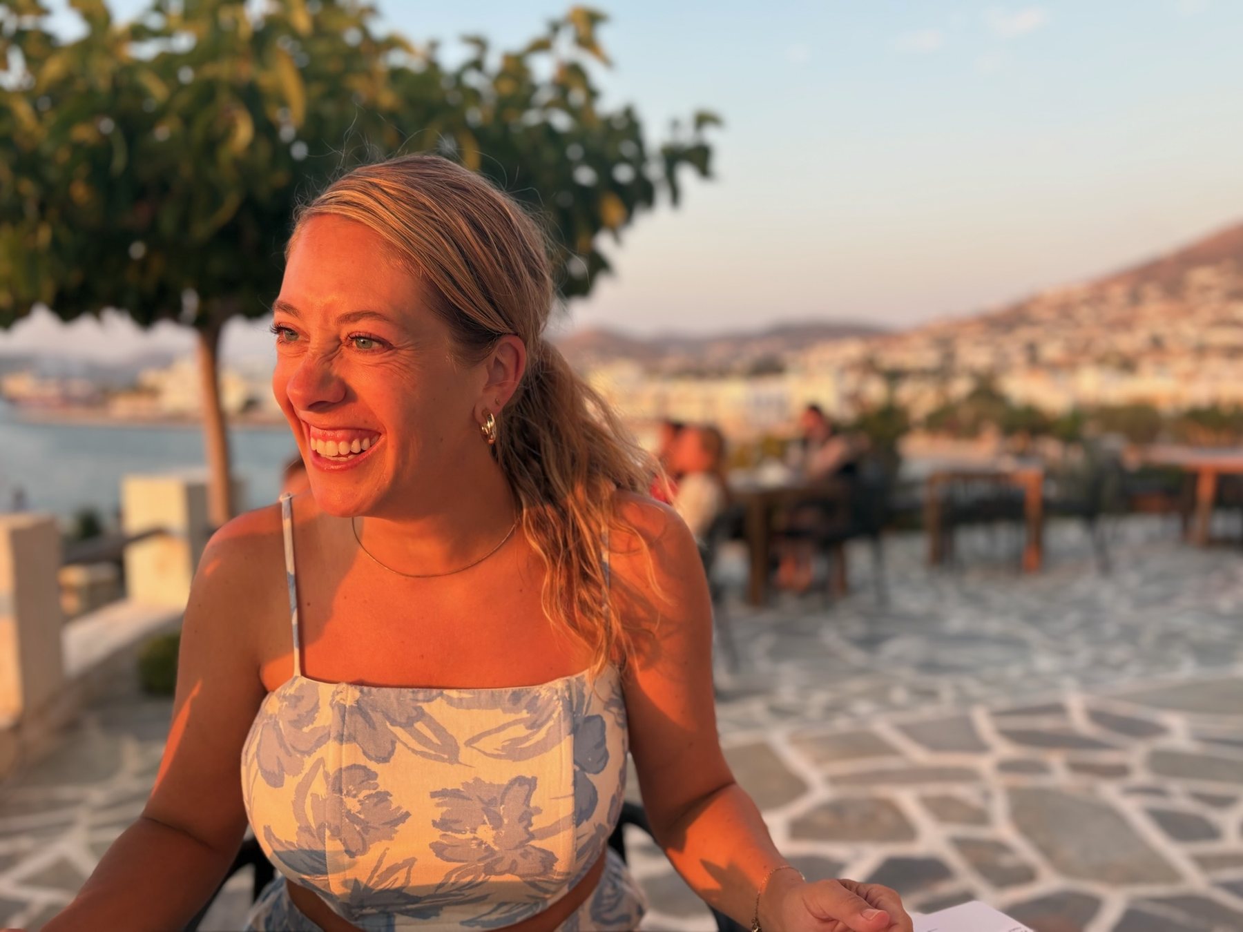 Tess smiling in warm golden light