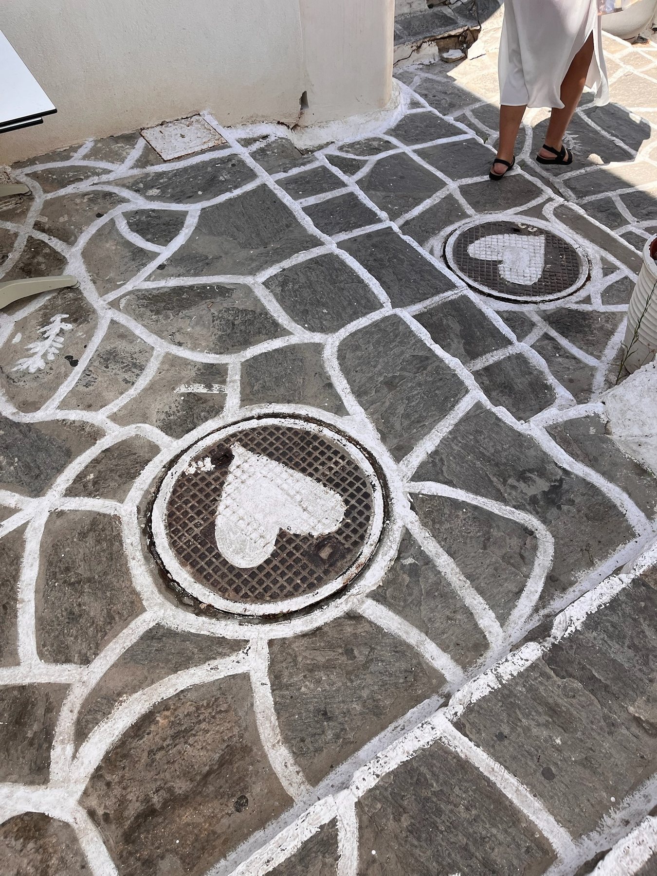 A small heart painted on stone paving